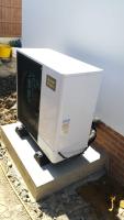 Air source heat pump installation outside new-build residential property