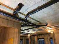 Copper pipe routing with support brackets fixed to ceiling