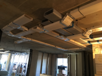 MVHR ductwork and insulation installed along ceiling